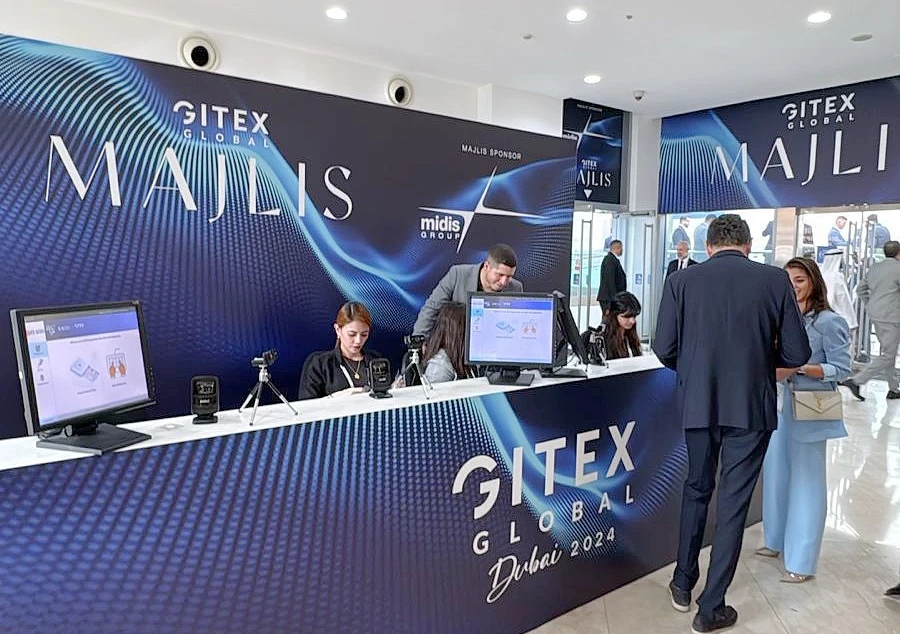 A GITEX graphic image in drak blue with red lettering