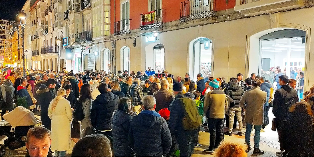 Crowds of people are seen outside a restored building