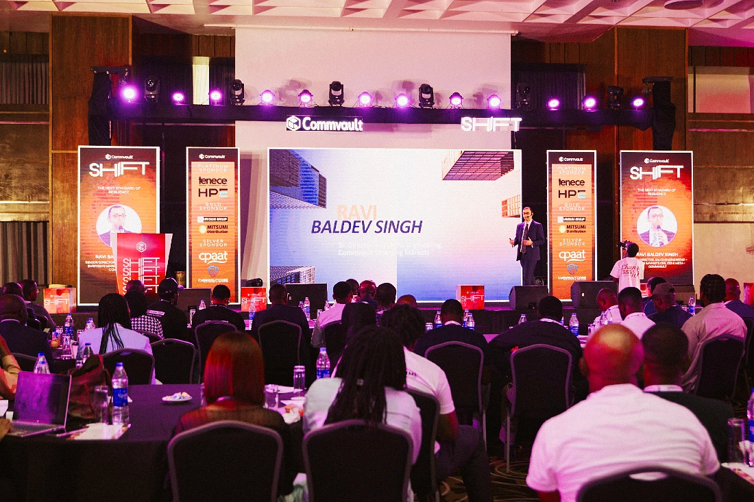 a man speaks to an audience at a hi tech event