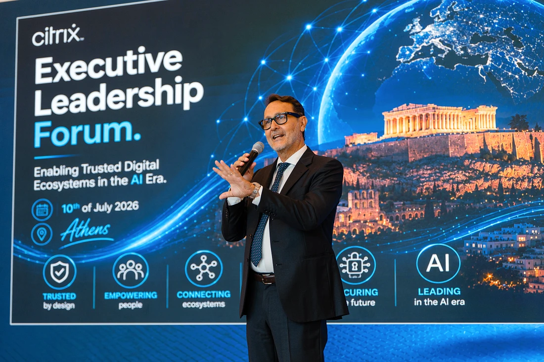 A man in a suit presents in front of a digital graphic with the words Citrix Executive Leadership Forum prominent 