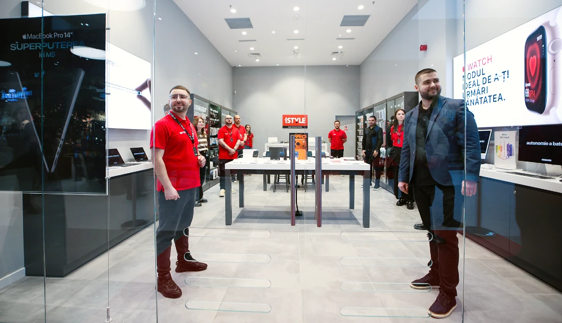 view of the interior of a hi tech store, with the staff standing and waiting for the public to enter